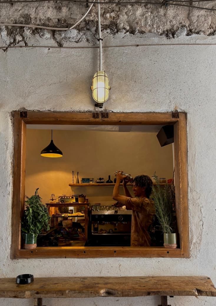 A barista at work behind Simane's espresso bar